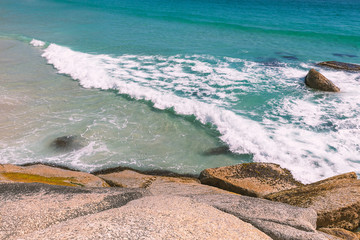 Beach with turquoise water and the rocks, natural background image