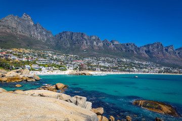 View of Camps bay beautiful beach with turquoise water and mountains in Cape Town, South Africa