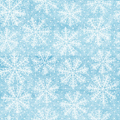 This is a winter textured background with snowflakes.
