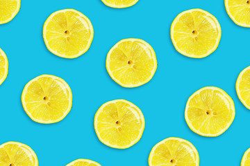 Fototapeta premium Sliced juicy lemon on a blue background. Fresh fruits. Fruit background.