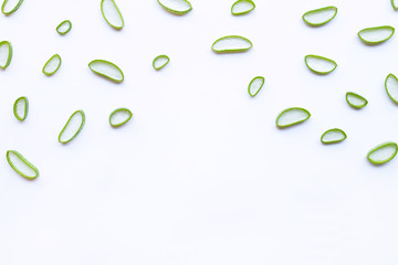 Aloe vera slices on white background.