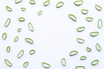 Aloe vera slices on white background.