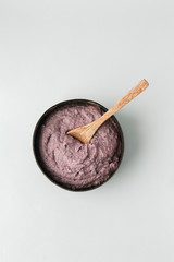 Healthy smoothie bowl , handmade plate made from coconut shell and wood spoon