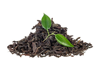 Dry black tea with green leaves isolated on white background