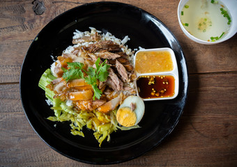 crispy pork belly on topped rice - Asian food style