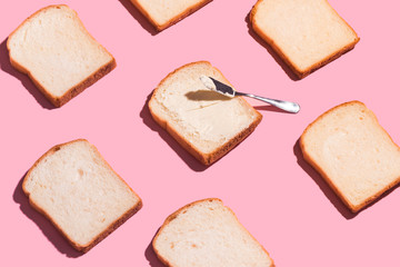 Sliced bread to toast isolated on pink background. Close up. Top view