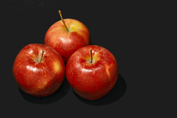 apples on black background