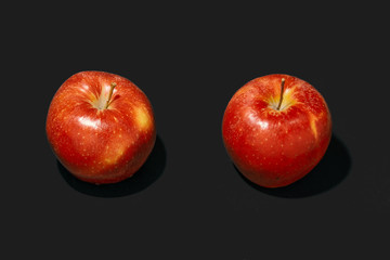 apples on black background