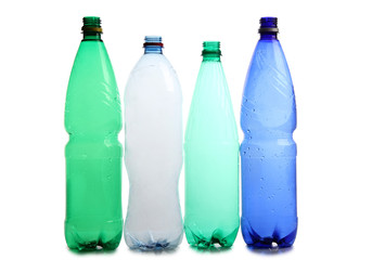 Bottle and glasses of water on white background