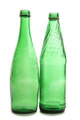 Bottle and glasses of water on white background