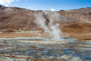 Iceland geothermal zone Namafjall - area in field of Hverir. Landscape which pools of boiling mud and hot springs. Tourist and natural attractions.