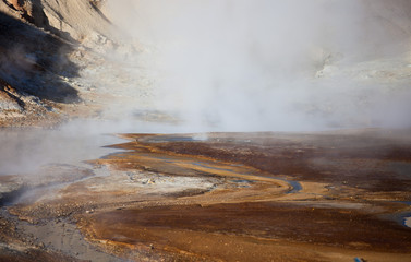 Iceland geothermal zone Namafjall - area in field of Hverir. Landscape which pools of boiling mud and hot springs. Tourist and natural attractions.