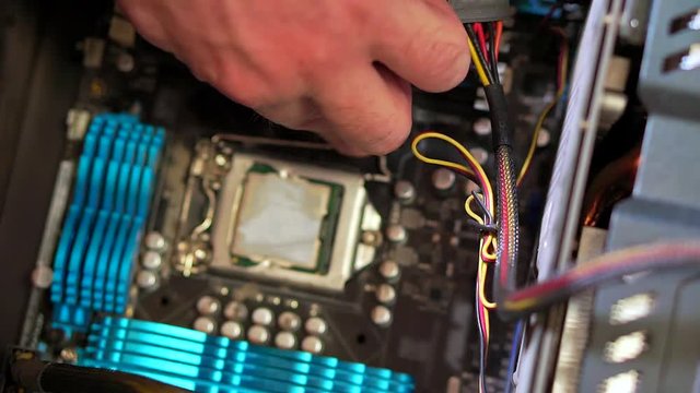 Close-up of hand serviceman uninstall CPU. Personal computer repair