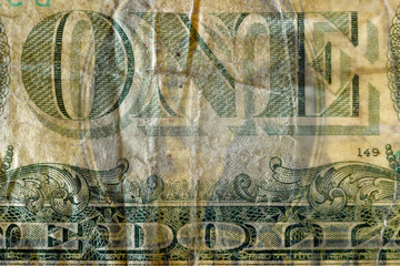 Fototapeta premium Money touch. ONE text, highly magnified surface of used 1 dollar banknote with visible details of cotton fiber paper, with all flaws, watermarks and traces of usage.