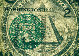 Banknote's skin. The Department of the Treasury Seal and the pyramid, highly magnified surface of used 1 dollar banknote with visible details of cotton fiber paper, with all flaws, watermarks and trac