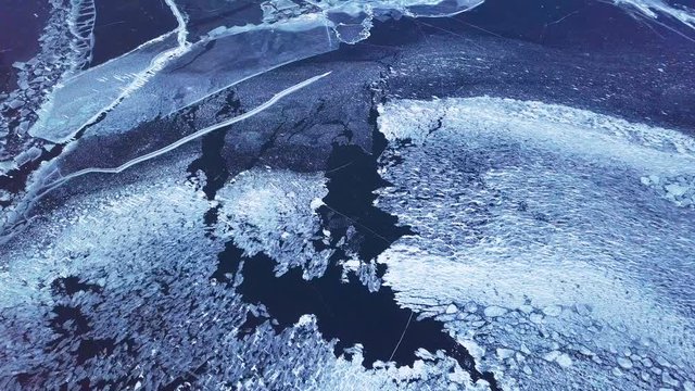 Cracks in ice from aerial view. Winter in Siberia, Baikal Lake.