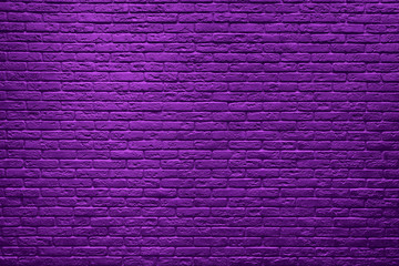 Violet brick wall background.