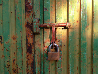 Padlock on Rusty Door