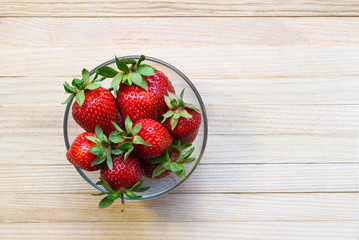 Organic ripe strawberry farmer in a glass bowl