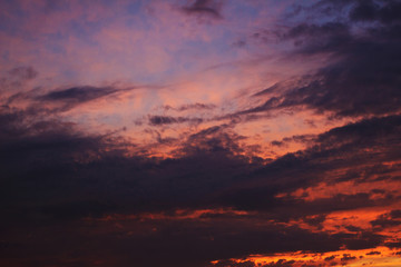 Evening sky. Bright pink sky with clouds.