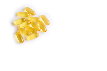Fish oil pills on a white background - vitamins and dietary supplements