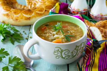 Arabic cuisine. Events Ramadan. Middle Eastern Mung bean soup on wooden table.