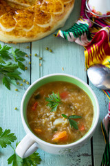Arabic cuisine. Events Ramadan. Middle Eastern Mung bean soup on wooden table. Copy space.