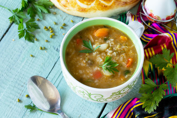 Arabic cuisine. Events Ramadan. Middle Eastern Mung bean soup on wooden table. Copy space.