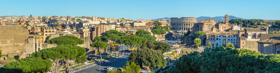 Scenic panorama of Rome with Colosseum and Roman Forum, Italy.