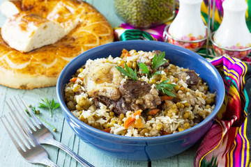 Arabic cuisine. Events Ramadan. Middle Eastern Mashkichiri (porridge made of rice, beef and mung bean) on wooden table.