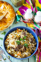 Arabic cuisine. Events Ramadan. Middle Eastern Mashkichiri (porridge made of rice, beef and mung bean) on wooden table.
