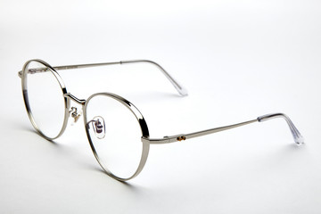 Silver frame of flat glasses on white background