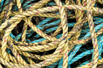 Fototapeta na wymiar Fishing ropes piled up, North coast, Scotland, UK.