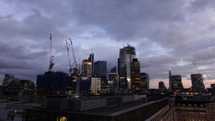 Photo from iconic modern skyscrapers in business district of Bank in the heart of London on a cloudy sky, Great Britain