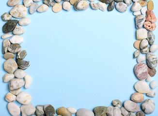 Sea Pebbles over Light Blue Background, Copy Space