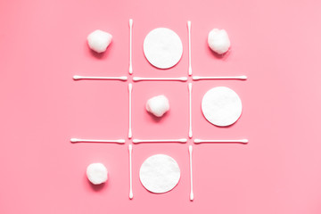 Tic tac toe game made from cotton pads, swabs, balls. Hygiene, makeup removal concept.