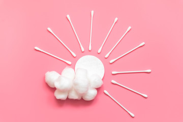 Sun with beams and cloud made from cotton pad and swabs. Hygiene, morning skin care routine.