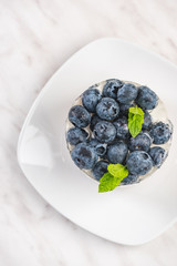 Blueberry cheesecake with mint, top view