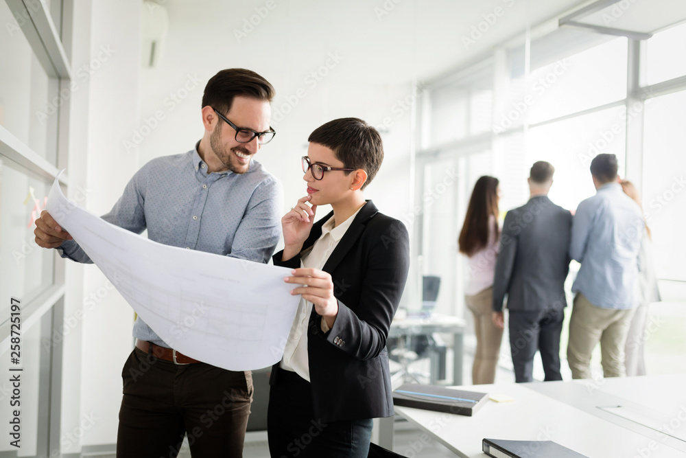 Wall mural business coworkers discussing new ideas and brainstorming in a modern office