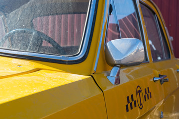 yellow taxi car closeup. chrome elements of the car body 60-70 years