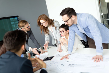 Business colleagues in conference room working together