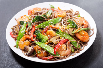 plate of Stir fried noodles with shrimps and vegetables