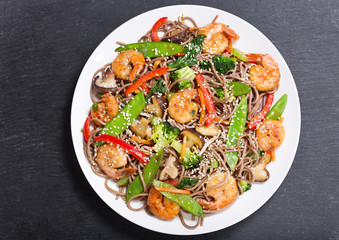 plate of Stir fried noodles with shrimps and vegetables