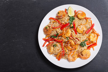 plate of Stir fried noodles with shrimps and vegetables