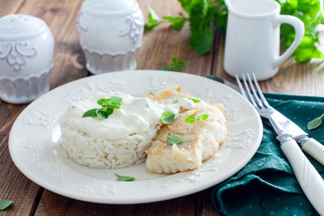 Fried cod, cooked with rice and cream sauce, horizontal