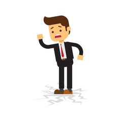 Business man standing on cracking floor