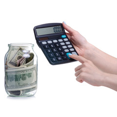 Money dollars bank notes in glass jar and calculator isolated on white background, concept save money