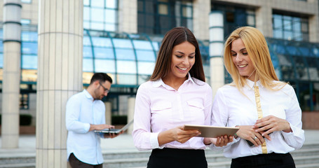 Picture of two young beautiful women as business partners