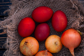 Painted eggs in onion peel, top view, selective focus