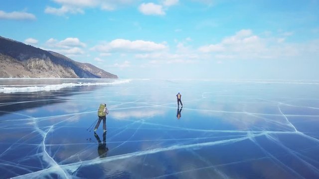 Tourists on the ice from aerial view. Winter in Siberia, Baikal Lake.